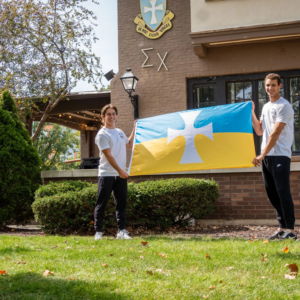 Sigma Chi Brothers Holding the Official Sigma Chi Flag