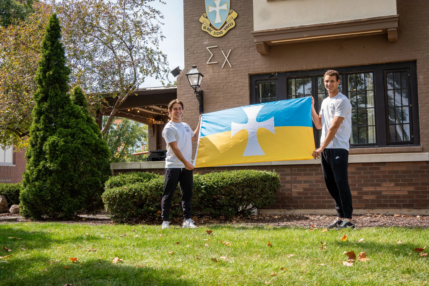 Sigma Chi Brothers Holding the Official Sigma Chi Flag